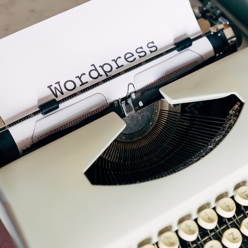white and black typewriter on white table